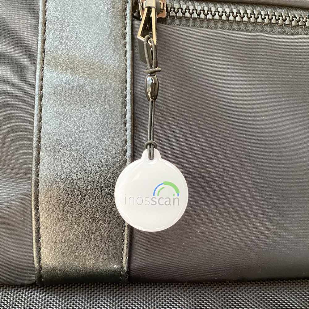 Epoxy NFC Tag attached to a zipper on a backpack